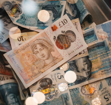 British pound notes and coins — the cash waiting when you sell your phone before values drop